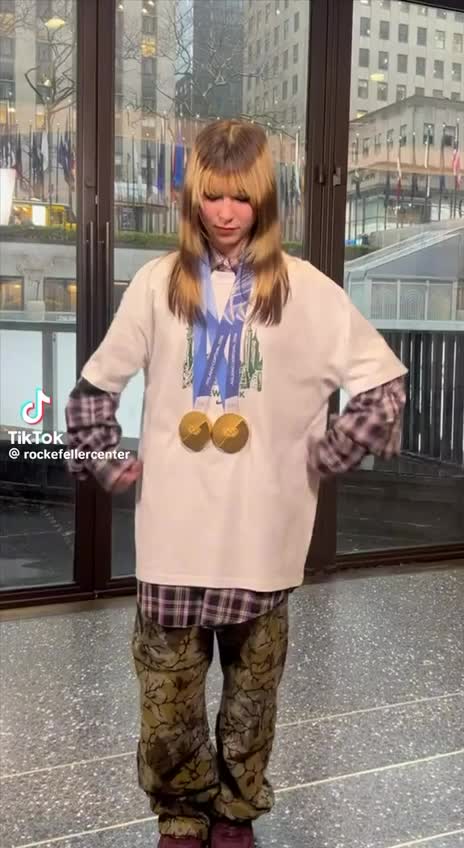 Alysa Liu in flannel and gold medals at Rockefeller Center