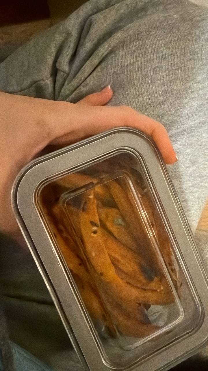 A literal tuna tin being held